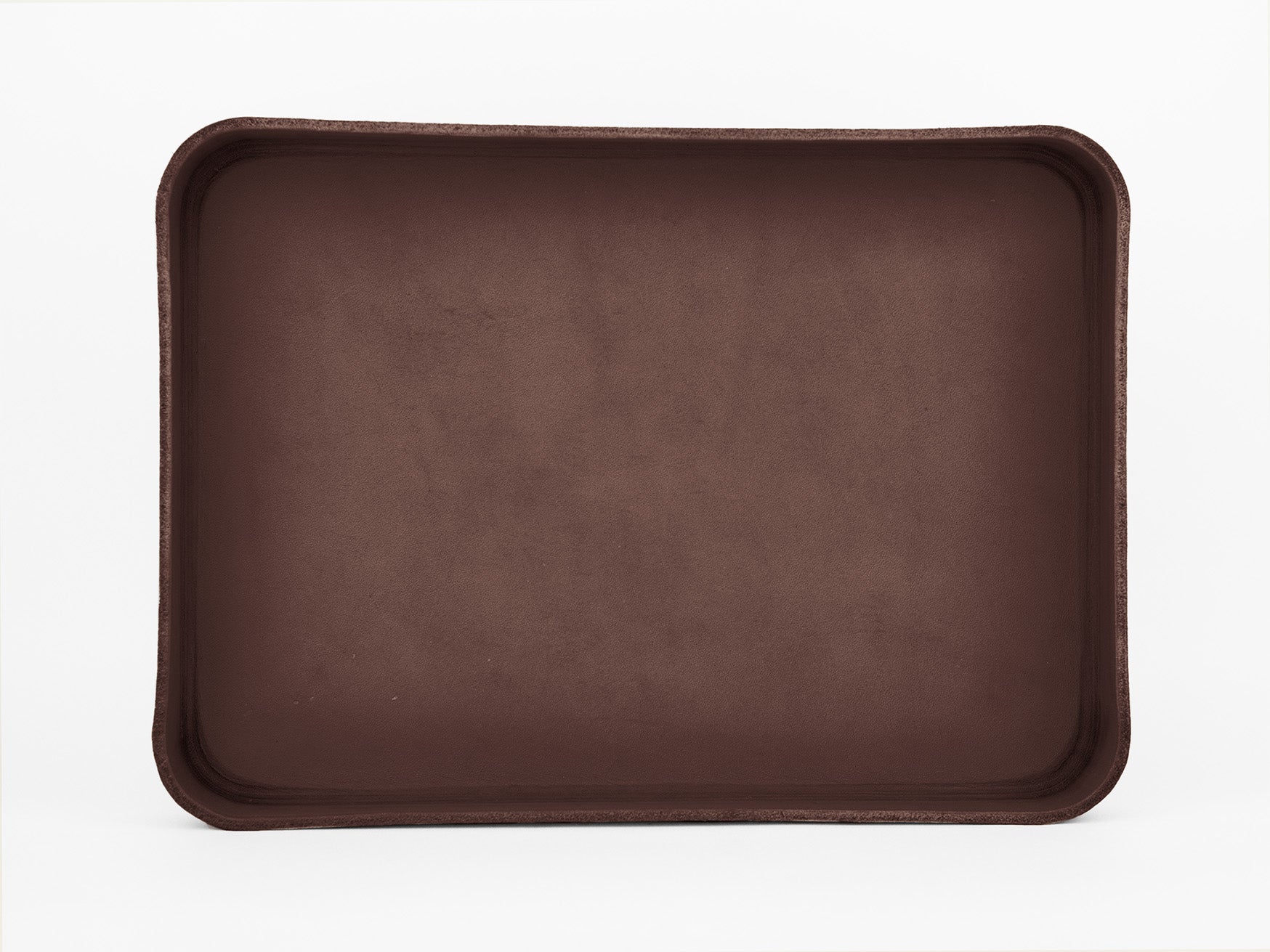 A rectangular, brown, empty tray with raised edges, viewed from above against a plain white background.