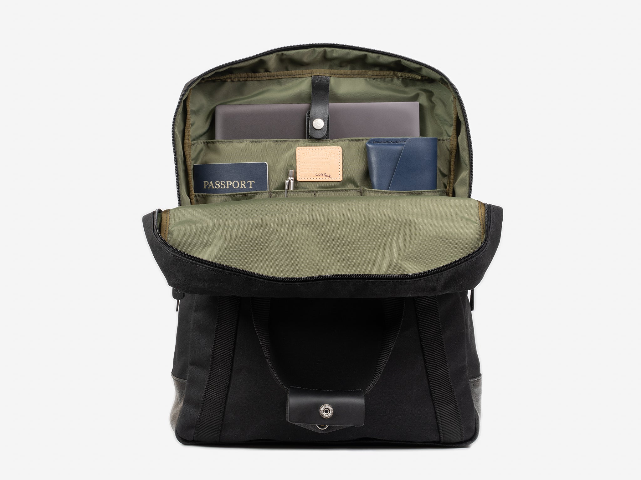 A neatly organized backpack with its front flap open, revealing a laptop, a passport, a pen, a blue notebook, and several compartments holding various items.