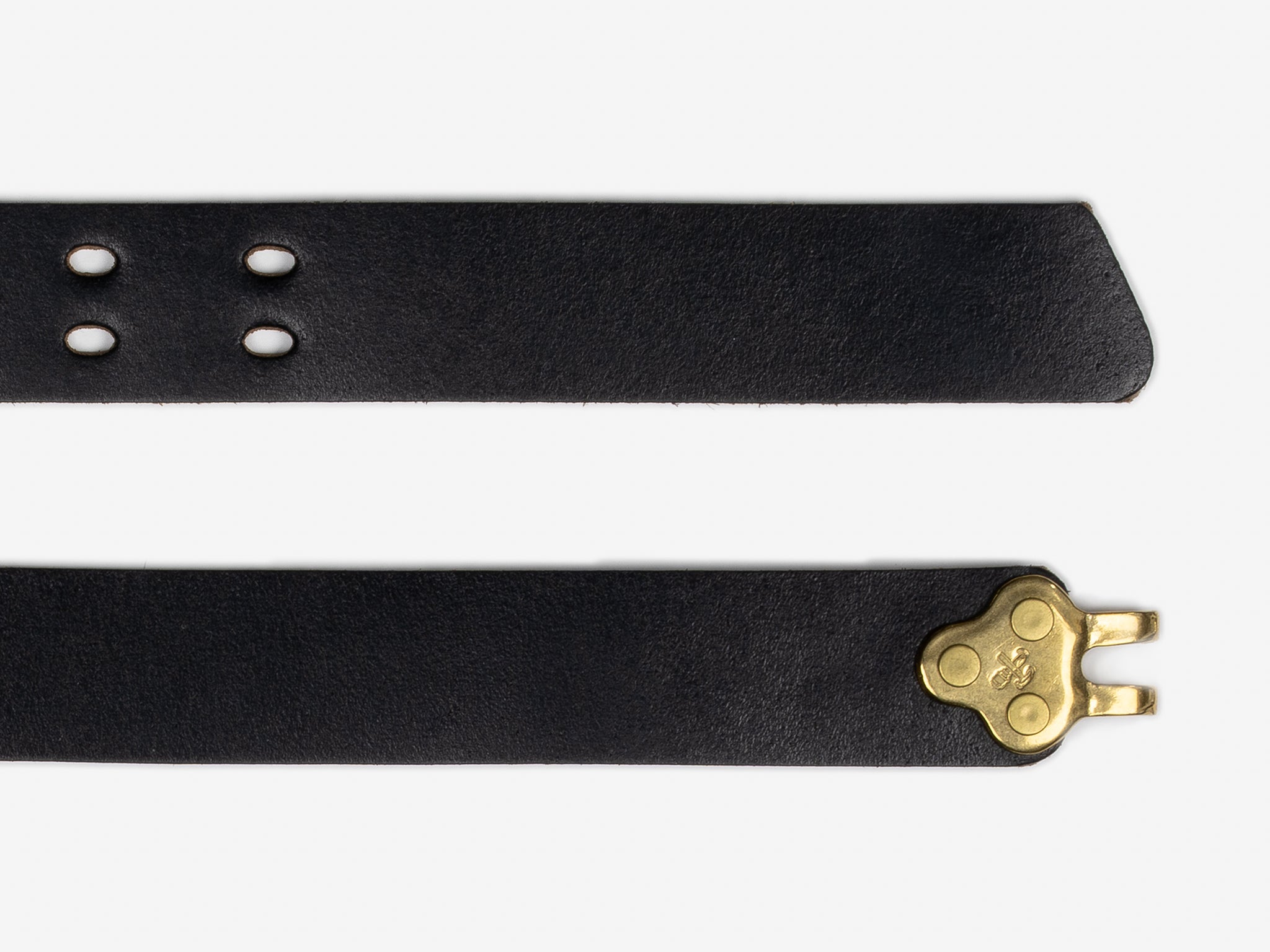 A close-up of a black leather belt featuring punched holes on one end and a brass key-shaped buckle on the other end, displayed against a white background.